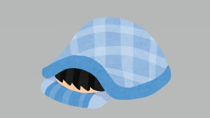 柴犬が布団に顔をうず…